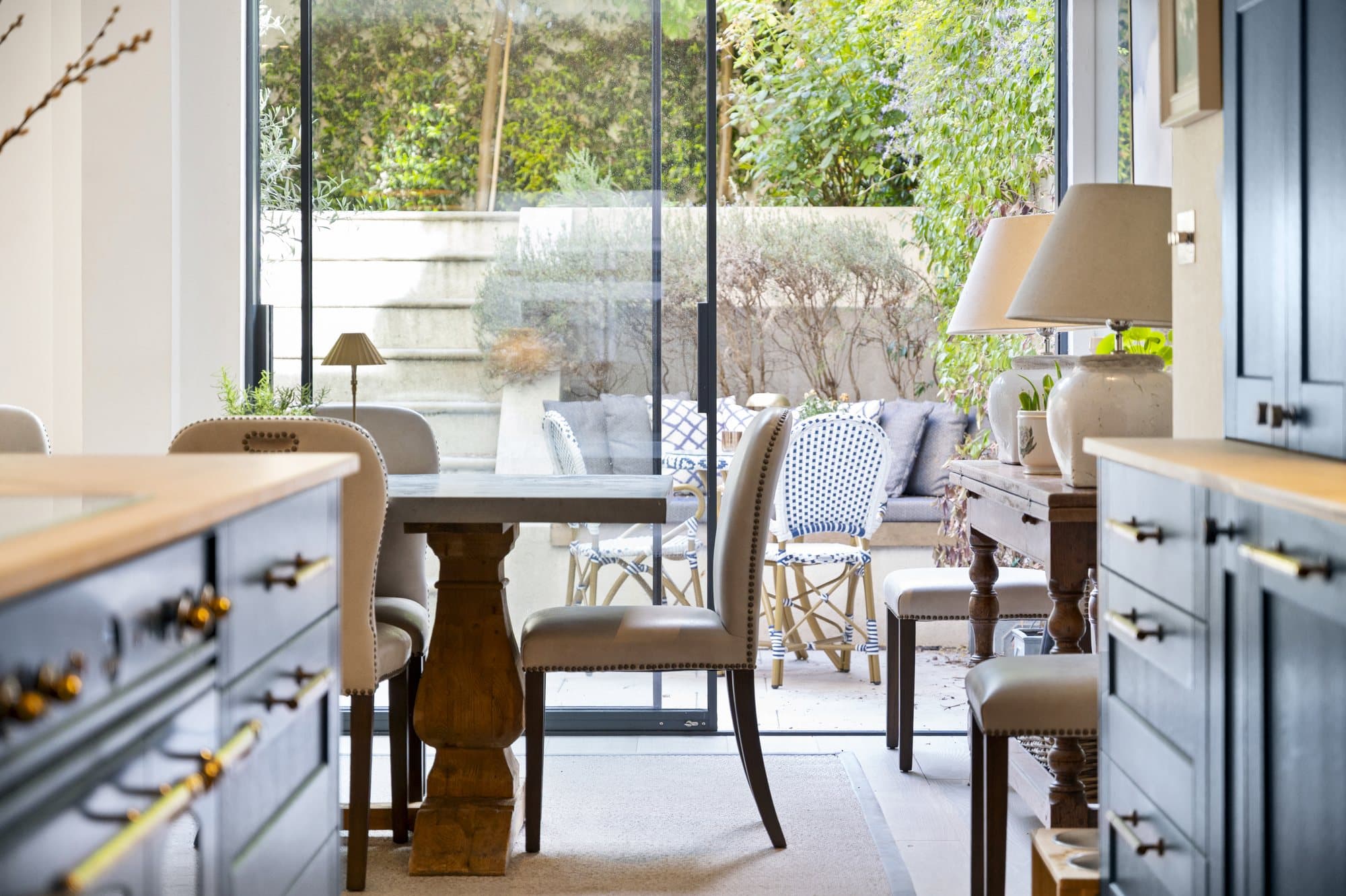 Kitchen island, staircase and garden beyond at Alma Terrace