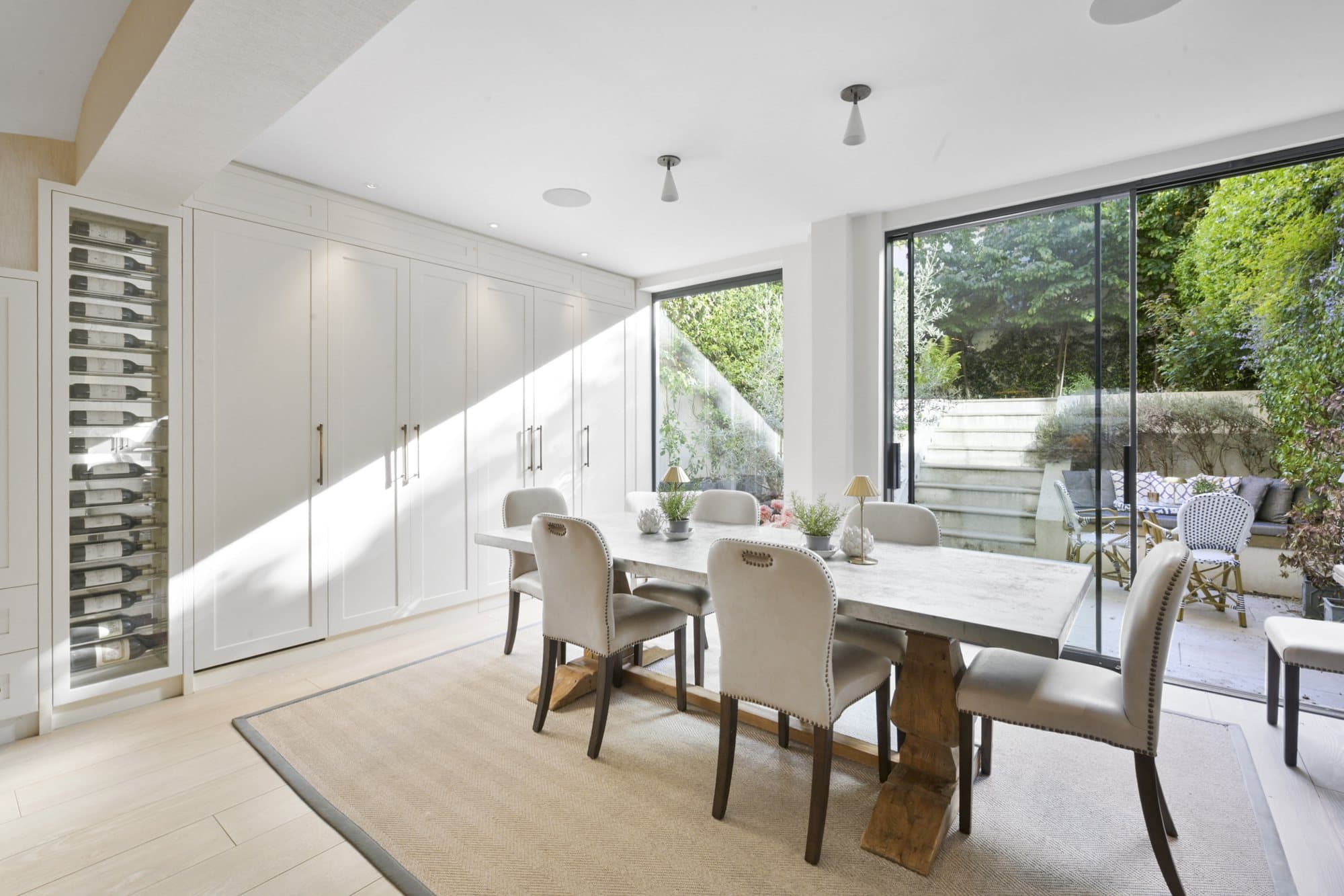 Kitchen island, staircase and garden beyond at Alma Terrace