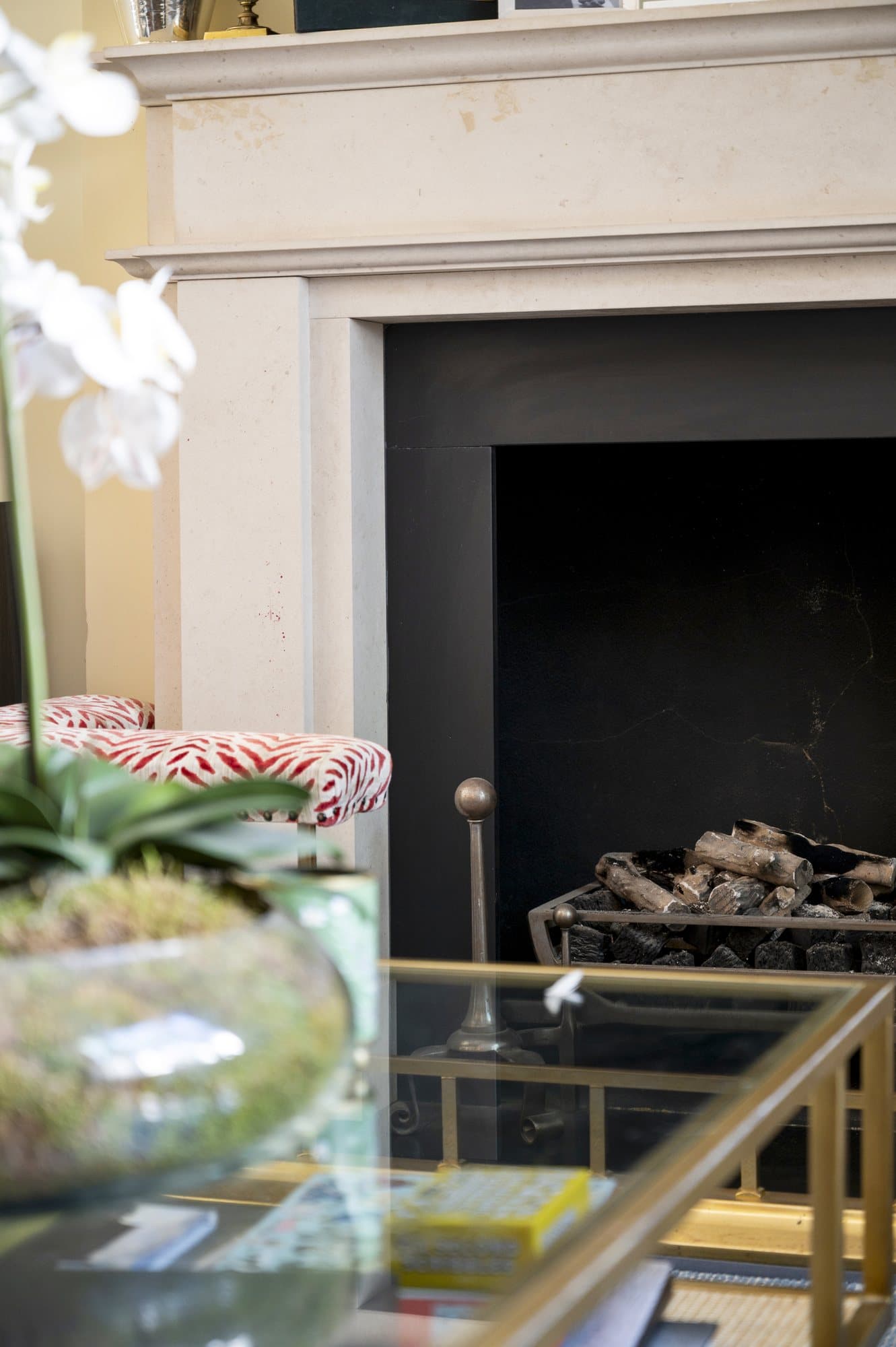 Fireplace with orchid and mirror above