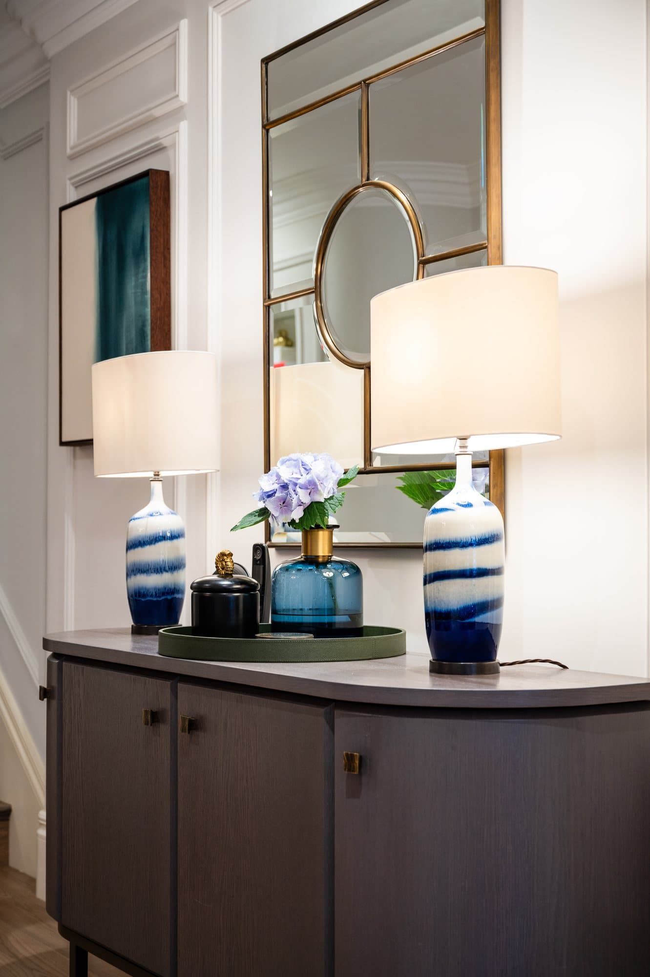 Lamps and glassware on a console
