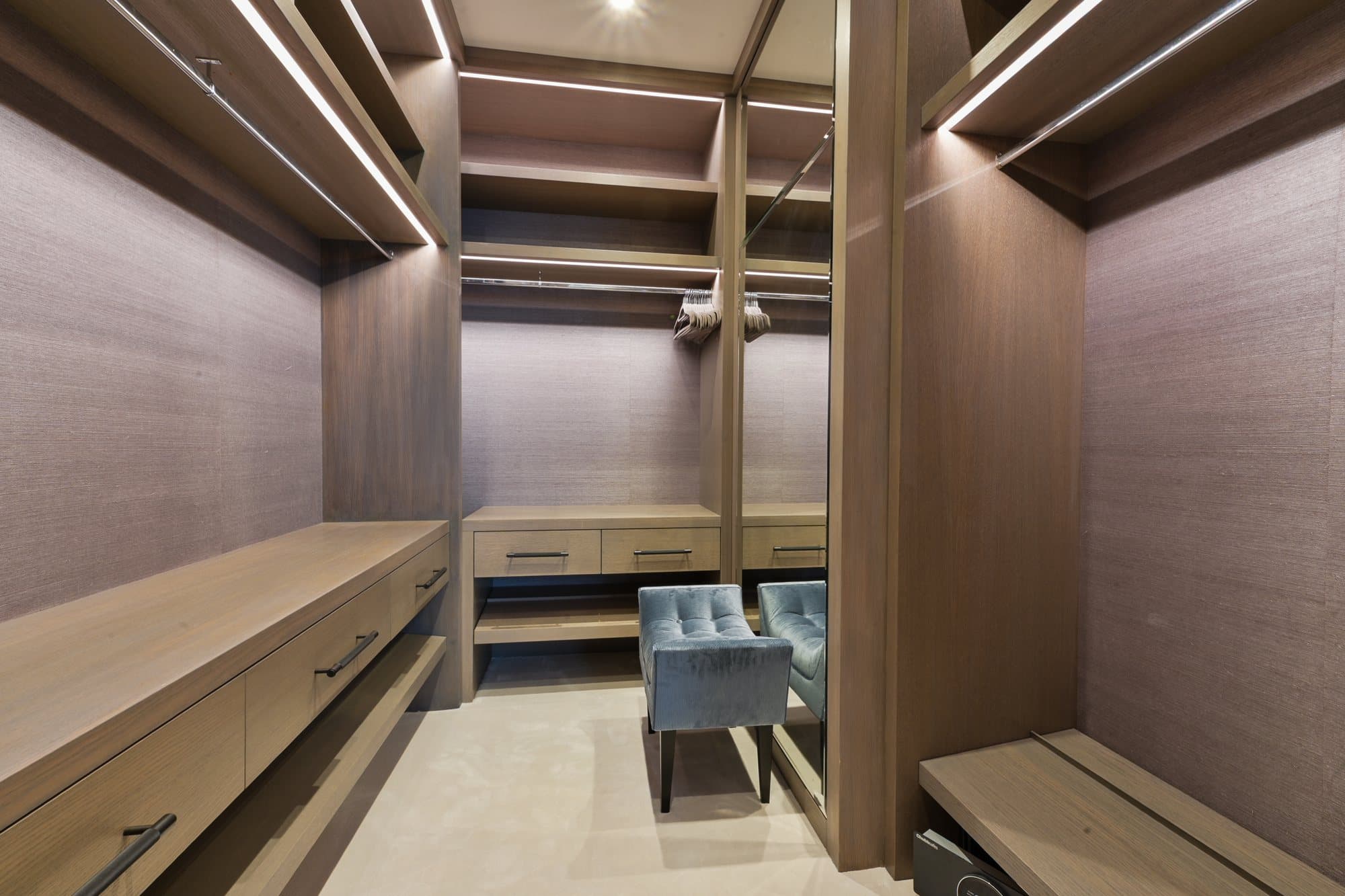 Walk-in wardrobe in pale timber