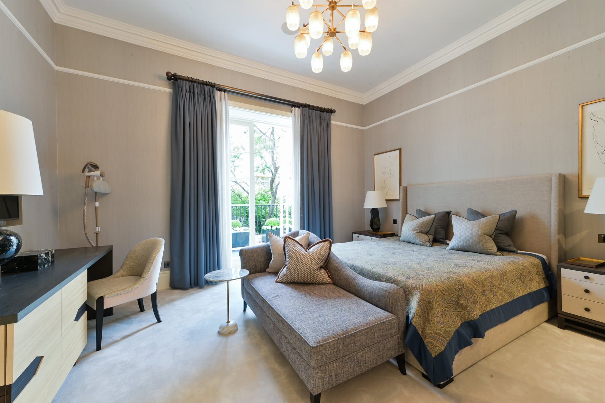 Bedroom with chandelier and long curtains