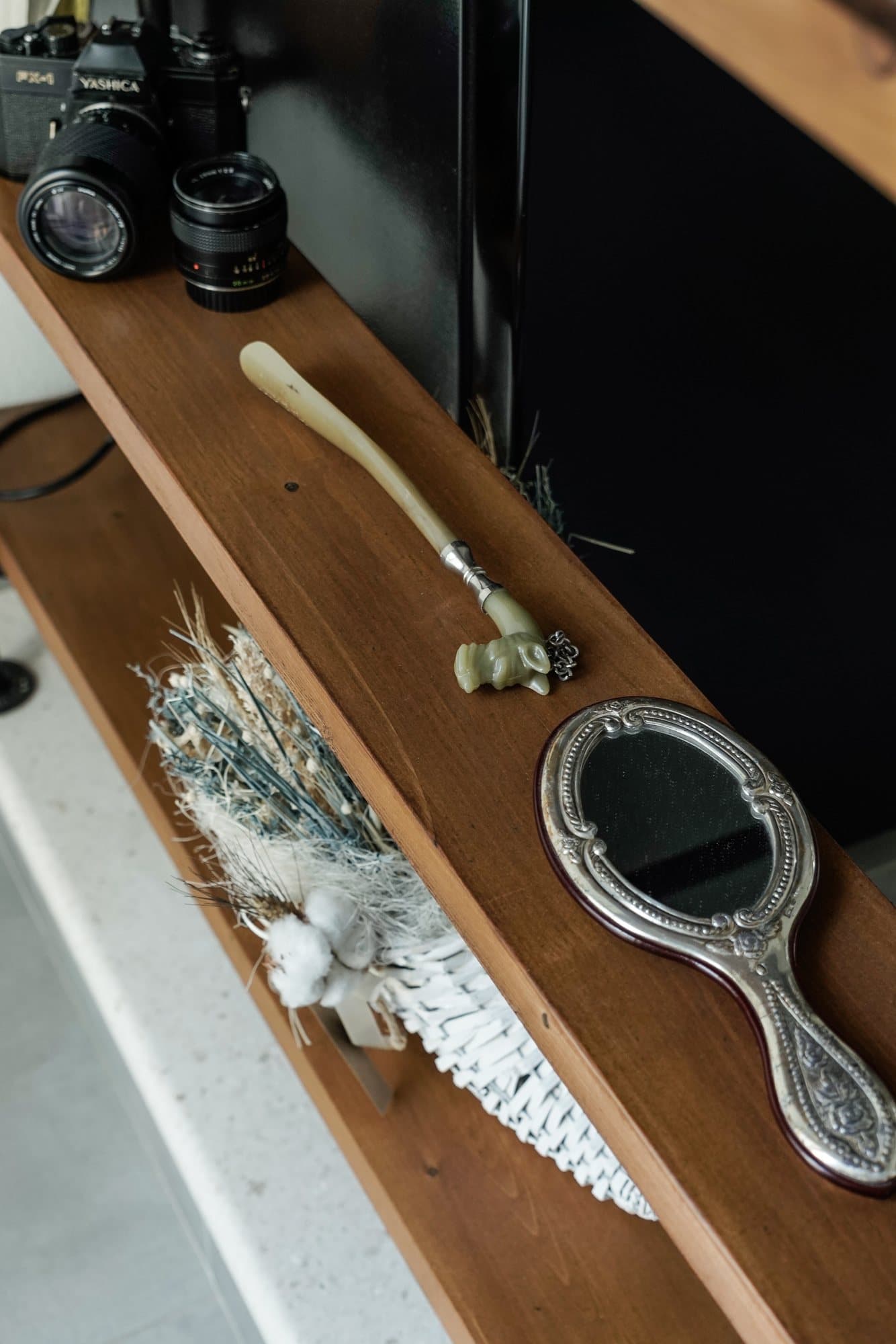 Camera and brushes laid out before a shoot