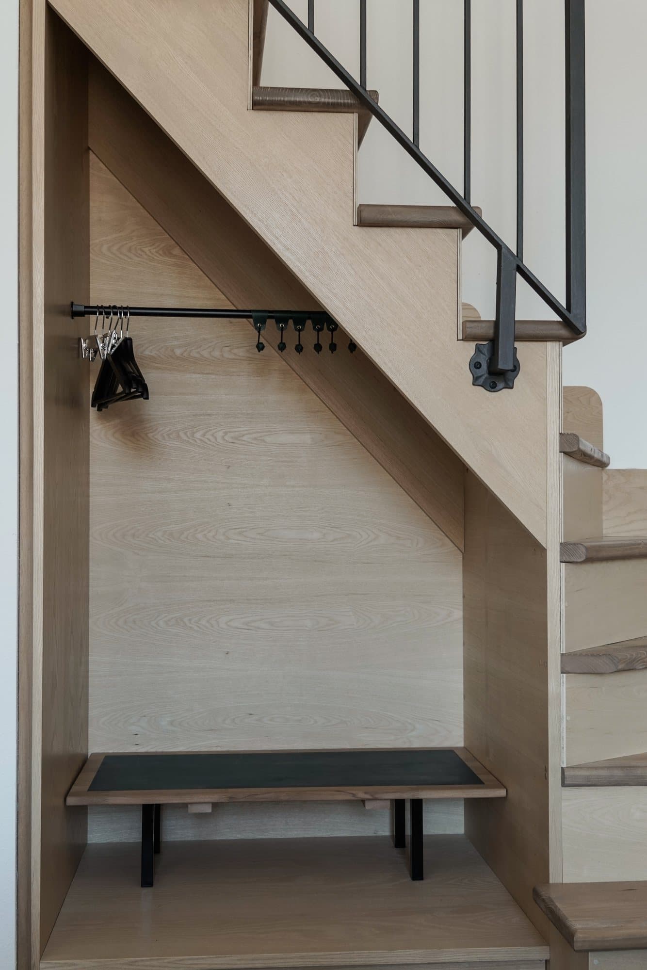 Minimal stair with a timber bench beneath